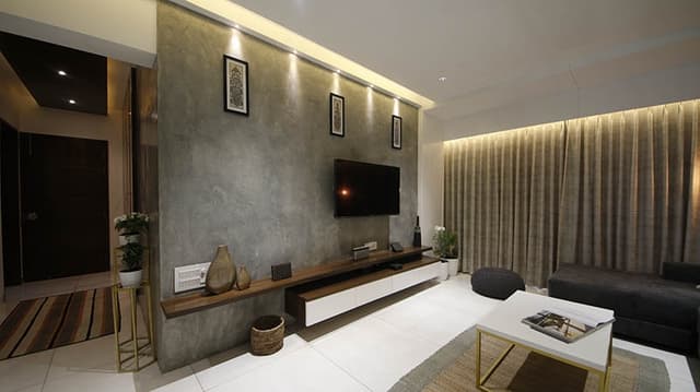 Modern-Living-Room-with-Teal-Blue-Coloured-Feature-Wall-with-Framed-Wall-Arts-highlighted-with-Track-Focus-lights-Yellow-Accents-Armchairs-3 Modern Living Room