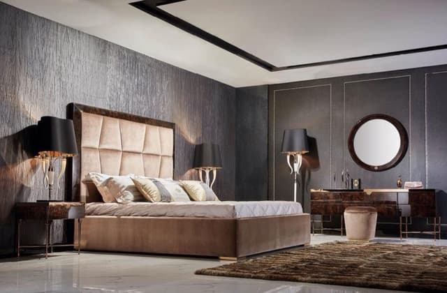 Modern-Luxurious-Bedroom-accommodating-Wooden-Bed-High-Back-Cushioned-Headboard-Side-Tables-with-Table-Lamps-placed-on-it Swiper Content 0