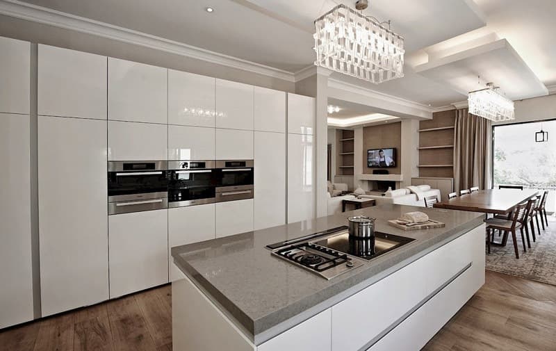 Modular-Kitchen-Island-with-a-Tall-Unit-for-the-entire-Wall-with-Built-in-Microwave-Oven Design Detail Banner 0