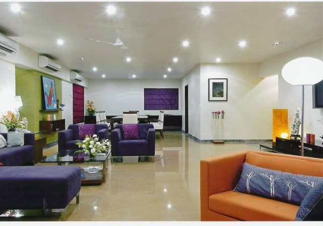 One-Plan-Concept-with-Living-Dining-consisting-Modern-Sectional-Chaise-Sofa-Sofa-Chairs-Center-Table-with-Glasstop-Floor-Lamp-T.V.-Unit-Decor-Wall Swiper Content 0