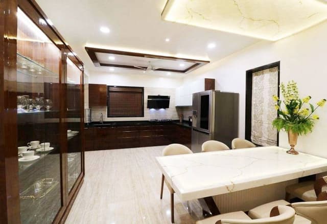 Open-Concept-Dining-Room-Kitchen-comprises-of-L-Shaped-Kitchen-Counter-2 Swiper Content 1