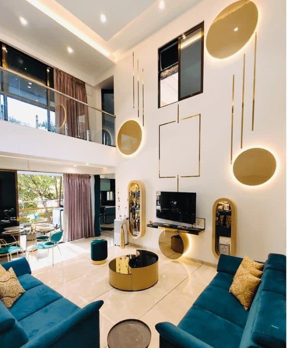 Open-Concept-Double-Heighted-Luxurious-Living-Dining-Room-with-Glazed-Facade-incorporates-Blue-Velvet-Pad-Arm-Sofa-Set Swiper Content 0