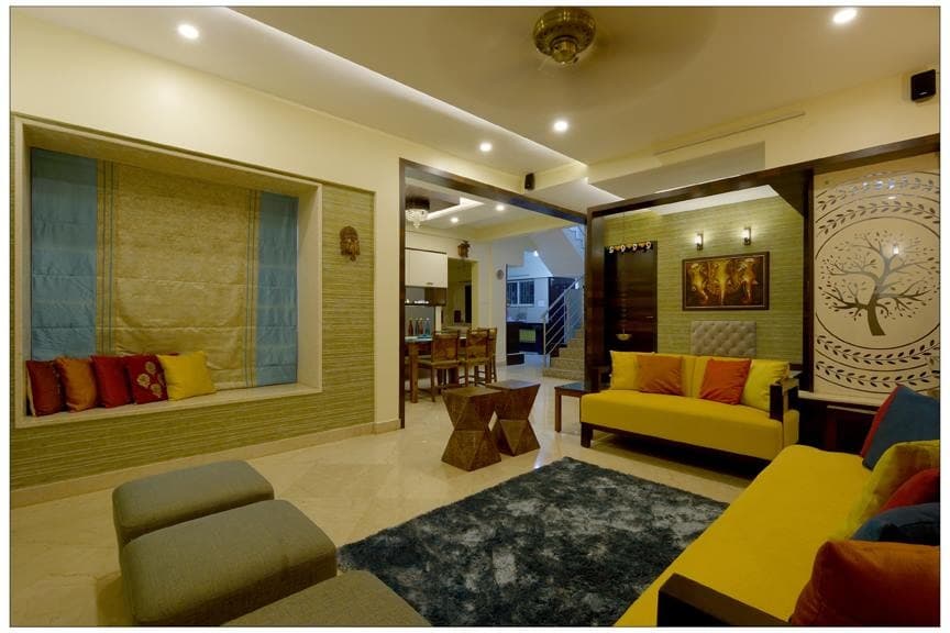 Open-Concept-Foyer-Living-Room-incorporates-Foyer-with-Wooden-Door-Floor-Mounted-Wooden-Chest-of-Drawers-Backlit-False-Ceiling-continuing-in-Wall.-1 Design Detail Banner 2