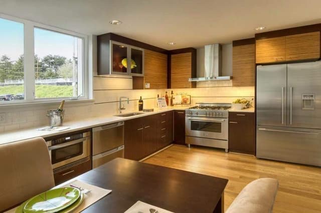 Open-Concept-Kitchen-Dining-Room-with-Wooden-Flooring-comprises-of-L-Shaped-Kitchen-Counter Swiper Content 0