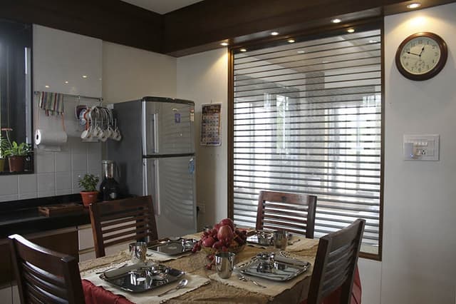 Open-Concept-Kitchen-and-Dining-Room-incorporates-L-Shaped-Kitchen-Counter. Swiper Content 1