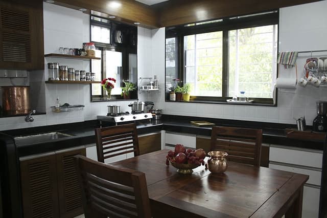 Open-Concept-Kitchen-and-Dining-Room-incorporates-L-Shaped-Kitchen-Counter Swiper Content 0