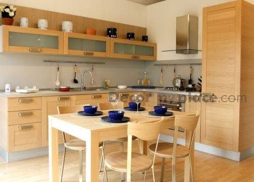 Open-Concept-Kitchen-and-Dining-Room-with-Wooden-Flooring-incorporates-L-Shaped-Kitchen-Counter-Built-in-Stove-with-Chimney-Lower-Kitchen-Cabinets-with-Metal-Handle Swiper Content 0