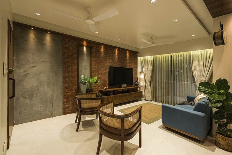 Open-Concept-Living-Dining-Room-comprises-of-Blue-Shaded-Square-Armed-Upholstered-Linear-Sofa-on-Wooden-Base-2 Design Detail Banner 1