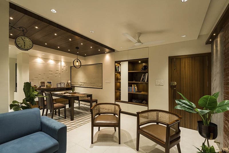 Open-Concept-Living-Dining-Room-comprises-of-Blue-Shaded-Square-Armed-Upholstered-Linear-Sofa-on-Wooden-Base-3-1 Design Detail Banner 2