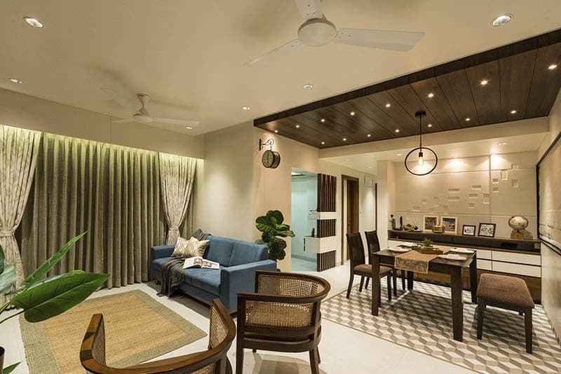 Open-Concept-Living-Dining-Room-comprises-of-Blue-Shaded-Square-Armed-Upholstered-Linear-Sofa-on-Wooden-Base-4-1 Design Detail Banner 3