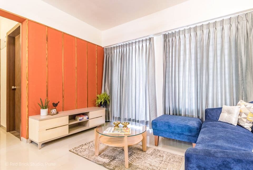 Open-Concept-Living-Dining-Room-comprises-of-Blue-Shaded-Tufted-Upholstered-Modular-Sofa-with-Wooden-Legs-2 Design Detail Banner 1