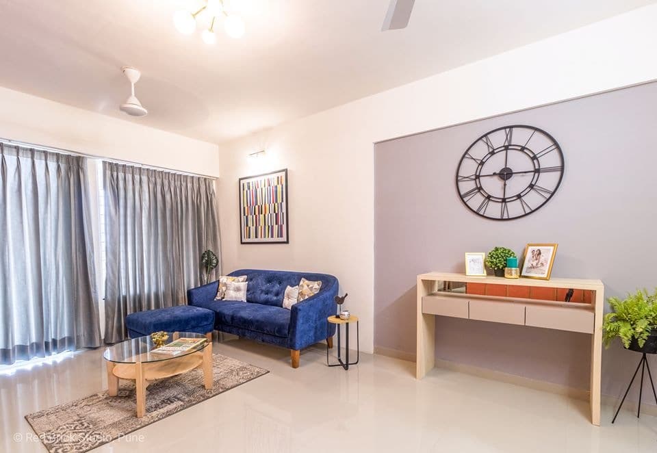 Open-Concept-Living-Dining-Room-comprises-of-Blue-Shaded-Tufted-Upholstered-Modular-Sofa-with-Wooden-Legs-3 Design Detail Banner 2