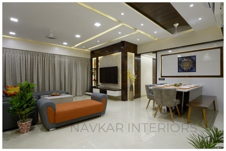 Open-Concept-Living-Dining-Room-comprises-of-Dark-Grey-Shaded-Tufted-Upholstered-L-Shaped-Sectional-Sofa-with-Right-Side-Facing-Chaise-1 Design Detail Banner 0