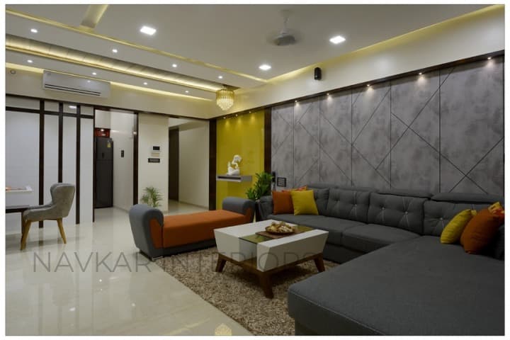 Open-Concept-Living-Dining-Room-comprises-of-Dark-Grey-Shaded-Tufted-Upholstered-L-Shaped-Sectional-Sofa-with-Right-Side-Facing-Chaise-2 Design Detail Banner 1