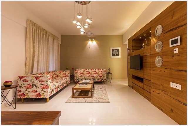 Open-Concept-Living-Dining-Room-comprises-of-Floral-Fabric-Upholstered-Square-Armed-Sofas-2 Swiper Content 1