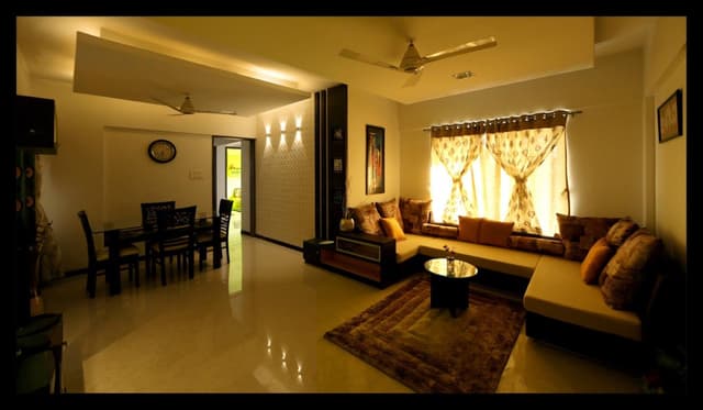 Open-Concept-Living-Dining-Room-with-a-C-Shaped-Wooden-Custom-made-Sofa-with-One-Side-Attached-End-Table-Cushions-1 Open Concept Living Dining Room