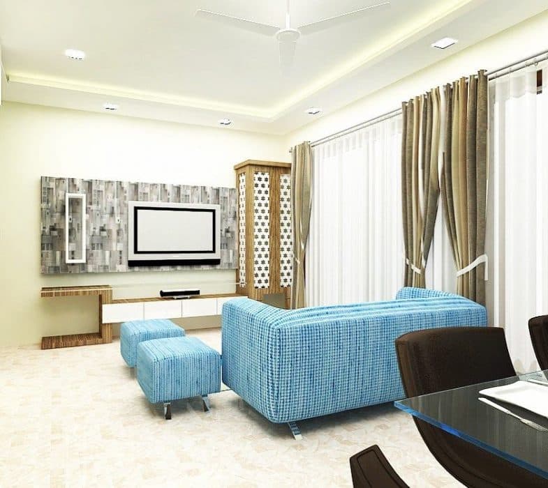 Open-Concept-Living-and-Dining-Room-comprises-of-Upholstered-Blue-Fabric-Square-Armed-Tuxedo-Sofa-with-Metal-Legs-Square-Ottomans-Coffee-Table-TV-Unit-Wall-Touch-4-Seater-Dining-Table. Design Detail Banner 0