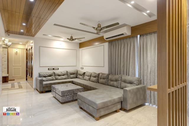 Open-Plan-Concept-of-Living-Dining-comprising-U-Shaped-Modern-Sectional-Chaise-Sofa-Stone-Cladded-Center-Table-with-Grooves-T.V.-Niche-under-Wall-with-Stone-Caldding-Wooden-Partition Open Plan Concept of Living Dining comprising U Shaped