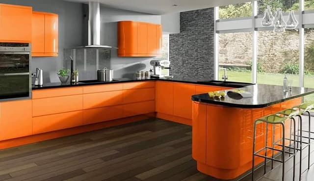 Orange-Coloured-C-or-U-–-Shaped-Kitchen-with-Black-Granite-Counter-top-attached-with-Peninsula-Kitchen-Island-Bar-Stools-Modular-Chimney-Black-Quartz-Composite-Sink-Double-Bowl. Swiper Content 0