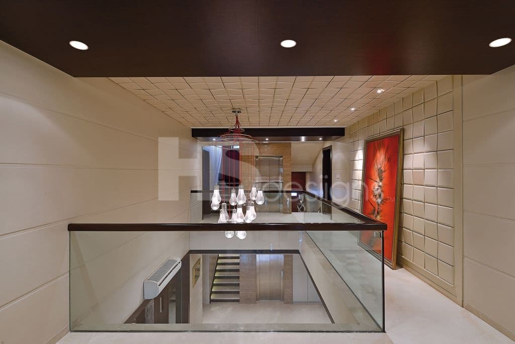 Passage-Area-on-Upper-Floor-has-Cutout-with-Glass-Railing-Wooden-Handrail Design Detail Banner 0