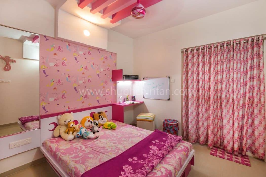 Pink-Coloured-Childrens-Bedroom-with-Wooden-Double-Bed-Wooden-Headboard-Bed-Back-Wall-with-Barbie-Themed-Pink-Wallpaper. Design Detail Banner 0