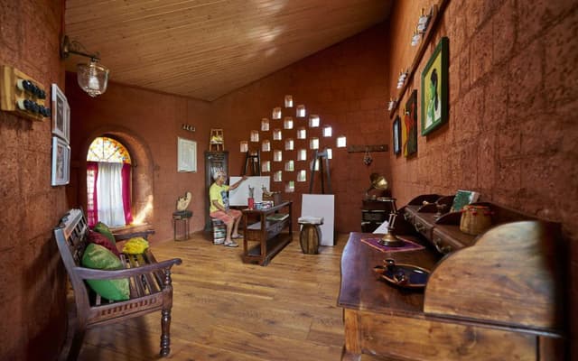 Rustic-Styled-Recreational-Room-designed-with-Wooden-Framed-Bench-with-Cushions Swiper Content 0