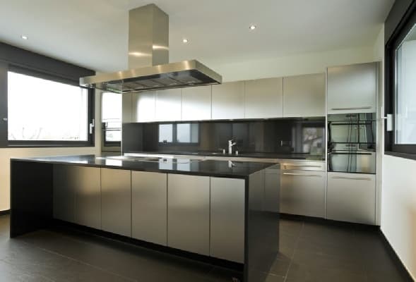 Single-Wall-Kitchen-accommodating-Kitchen-Island-with-Built-in-Induction-Hob-Island-Chimney-Storage-below-Parallel-Kitchen-Counter-with-Lower-Upper-Cabinets. Swiper Content 0