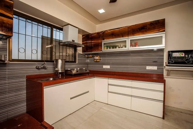 Small-L-Shaped-Kitchen-with-Granite-Countertop Swiper Content 0