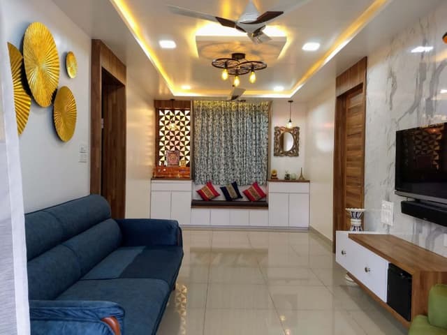 Small-Living-Room-incorporating-Blue-Upholstered-Sofa-with-Wooden-Base Swiper Content 1