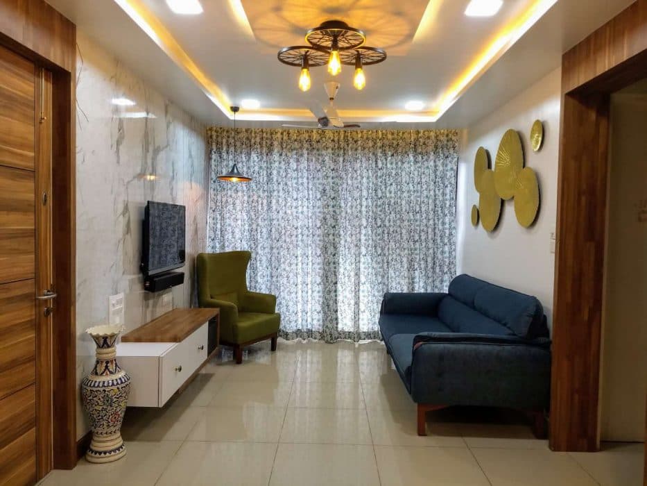 Small-Living-Room-incorporating-Blue-Upholstered-Sofa-with-Wooden-Base. Design Detail Banner 0