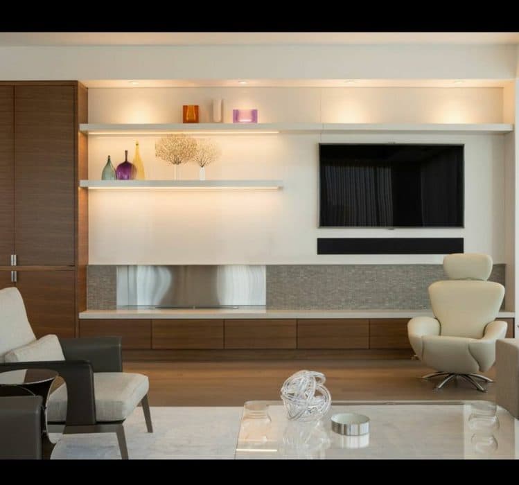 TV-Unit-made-of-a-Wood-Floating-Wall-Shelves-Drawers-in-a-Combination-of-White-Wood-Grey-is-Satisfying-the-Whole-Living-Space. Design Detail Banner 0