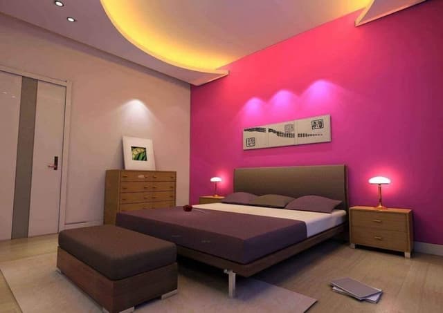 The-Bedroom-Design-is-Simple-Minimal-with-a-POP-Curved-designed-False-Ceiling-well-illuminated-with-Cove-Lights. Swiper Content 0