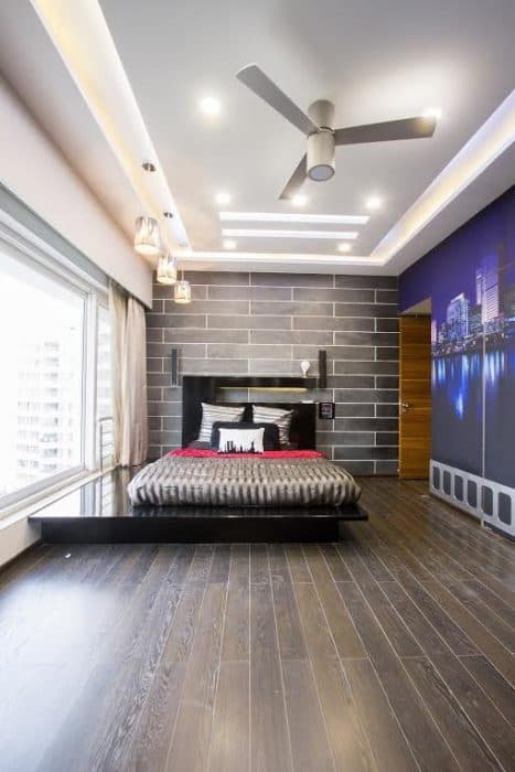 The-Combination-of-White-Black-Grey-is-complementing-each-other-in-the-whole-Space.-Extended-Bed-area-towards-window-apart-from-Bed-Sheet-is-making-this-Bed-Unique. Design Detail Banner 0