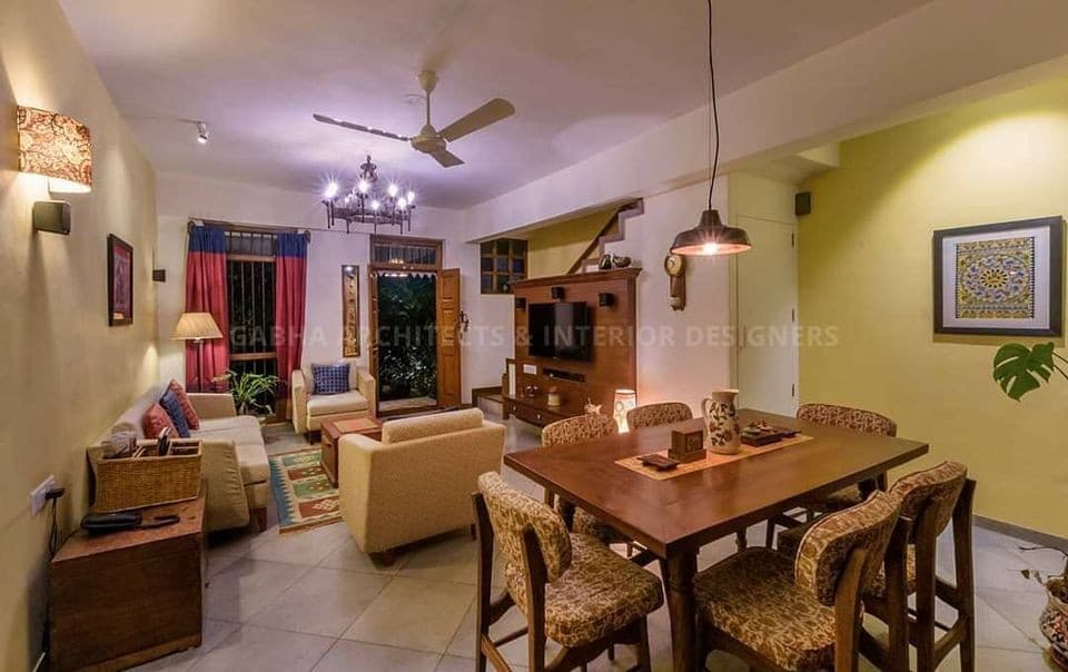 The-Dining-Space-in-an-Open-Living-Room-goes-well-with-the-Play-of-Woods Design Detail Banner 1