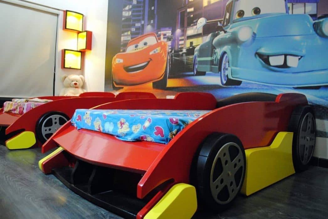 The-Disney-Car-Theme-Kids-Bedroom-is-a-personalized-Space-of-ones-Choice.-Red-Yellow-Colour-Car-shape-Bed-is-making-it-Unique-from-the-Regular-Bedroom. Design Detail Banner 0