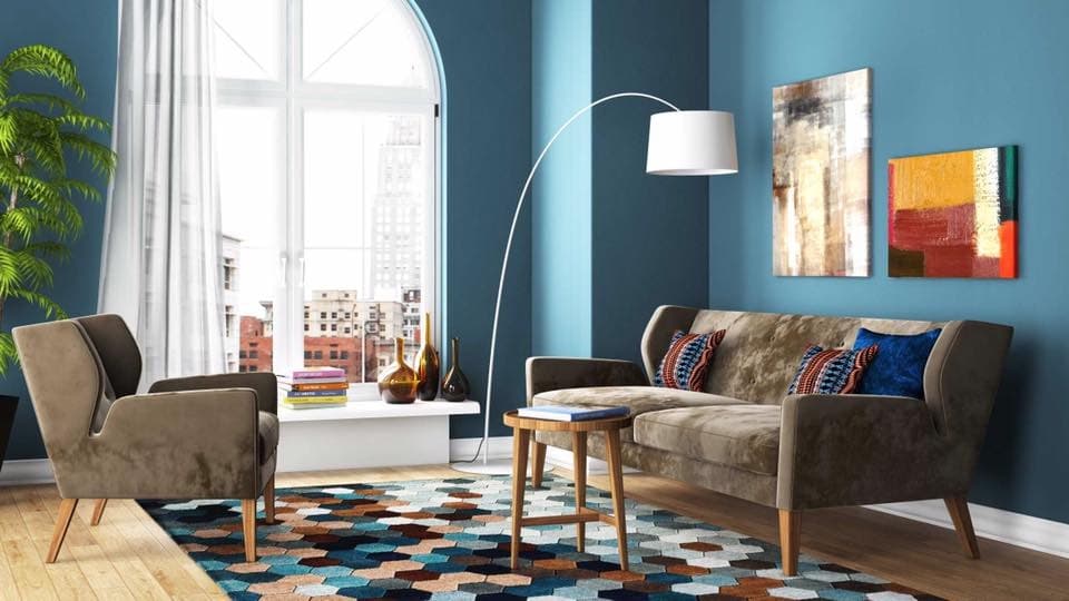 The-Earthen-Brown-Velvet-Upholstered-3-Single-Seater-Wingback-Sofa-with-Wooden-Legs-is-making-a-Good-Combination-with-Teal-Blue-Walls. Design Detail Banner 0