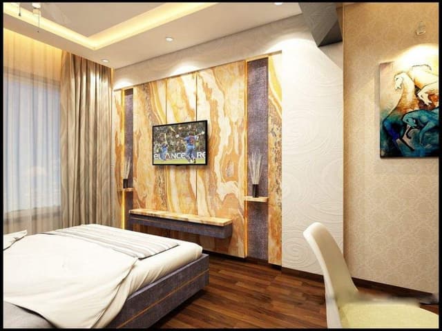 The-Modern-Bedroom-with-Wooden-Flooring-Box-Bed-with-Wall-Mounted-attached-Side-Tables-incl.-high-Mirrors-on-both-sides-High-Headboard-with-Padded-Tiles Swiper Content 1