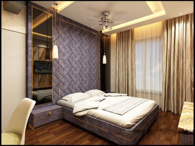 The-Modern-Bedroom-with-Wooden-Flooring-Box-Bed-with-Wall-Mounted-attached-Side-Tables-incl.-high-Mirrors-on-both-sides-High-Headboard-with-Padded-Tiles. Swiper Content 0
