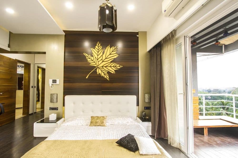 The-main-Colours-White-Dark-Brown-Cream-is-used-in-this-Bedroom.-White-Backrest-with-Dark-Brown-Panelling-is-highlighting-the-Sleeping-Area-in-Bedroom. Design Detail Banner 0