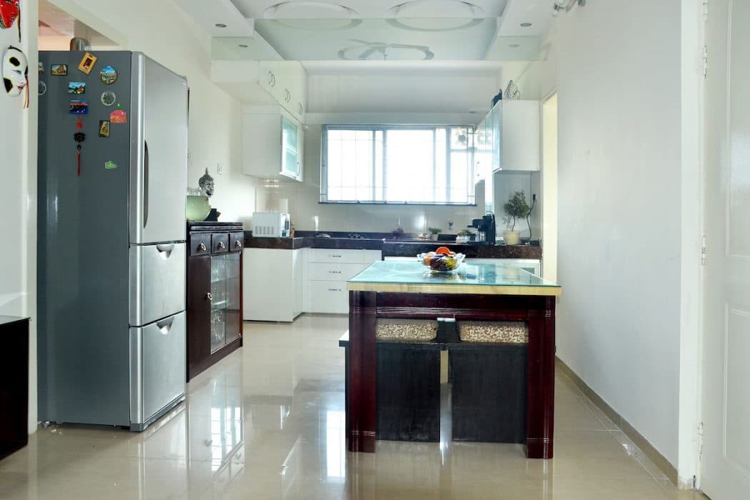 The-use-of-White-Colour-in-this-Compact-Single-Wall-Kitchen-is-making-it-more-Lighted-Spacious. Design Detail Banner 0