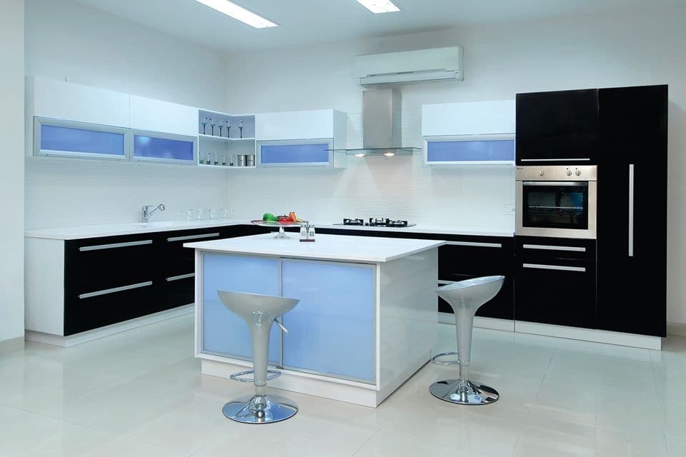 This-Black-White-Kitchen-with-Island-Platform-consists-3-Burner-Built-in-Gas-Stove-with-Chimney-Oven-Unit-S.S.-Sink. Design Detail Banner 0