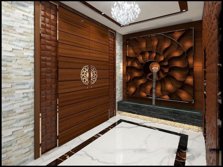 This-Conceptual-3D-image-of-the-Foyer-consists-Wooden-Door-with-Half-a-Circular-Decorative-Door-Handle-Trapezoidal-3D-Wall-Panels-on-both-sides-of-it. Design Detail Banner 0