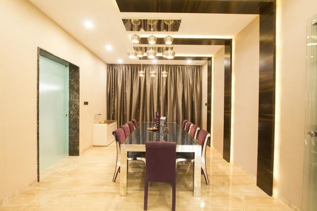 This-Dining-Space-Consists-10-Seater-Dining-Table-with-Glass-Top-High-Backrest-Purple-Chair. Swiper Content 0