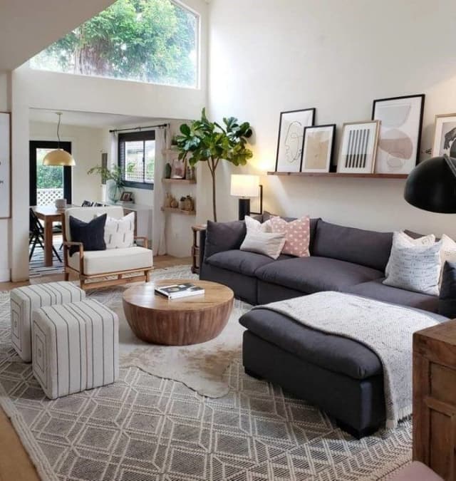 This-Exotic-Style-Living-Room-has-a-L-shape-Dark-Grey-Upholstered-Sofa Swiper Content 0