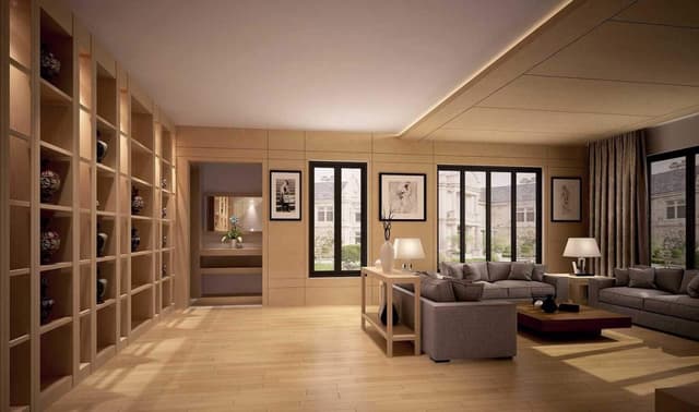 This-Living-Room-has-a-Beige-Colour-Theme-making-a-Beautiful-Combination-with-Grey-Upholster-Cushioned-Sofa.-This-Grid-Pattern-Partition-Displaying-Artifacts-in-this-Space. Swiper Content 0