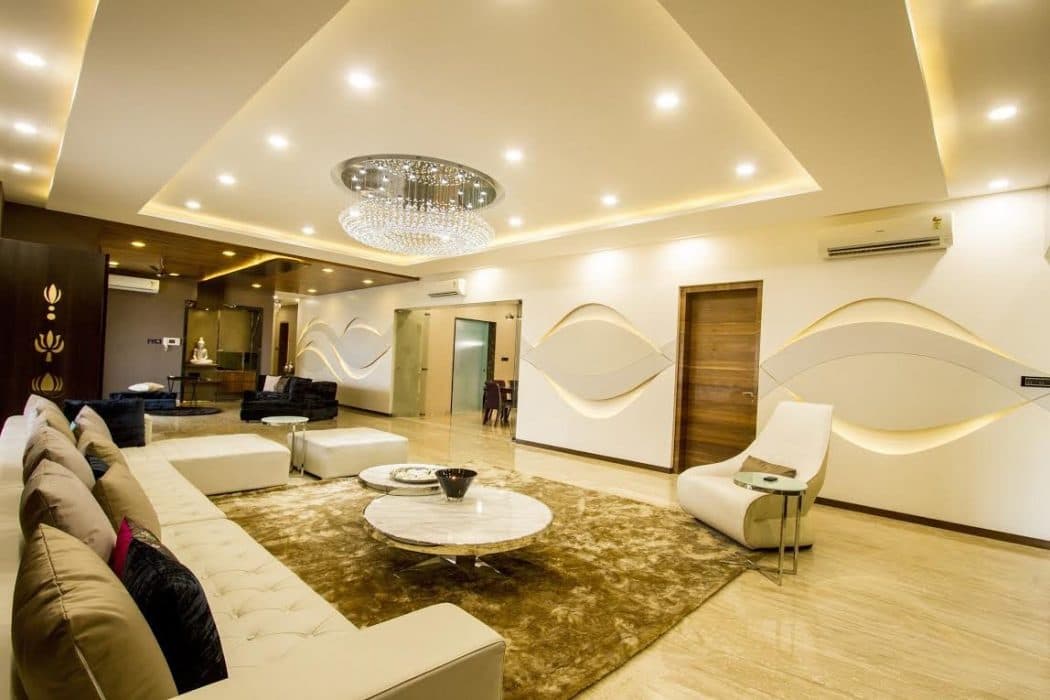 This-Luxurious-Living-Space-Consists-White-Sectional-Sofa-with-Cushions.-Multilevel-Circular-Center-Table-with-Metal-Frame-Floor-Rug-is-Functionally-Supporting-the-Space.-2 Design Detail Banner 1