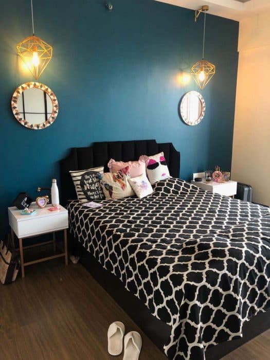 This-Single-Bed-with-Black-White-Geometrical-Pattern-Bedsheet-and-White-Side-Table-with-Single-Drawers-Nicely-Placed-in-this-Compact-Space. Swiper Content 0