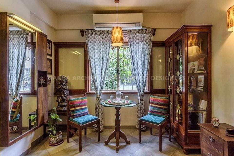 This-Traditional-Coffee-Table-area-with-a-Wooden-Armless-Chairs Design Detail Banner 0