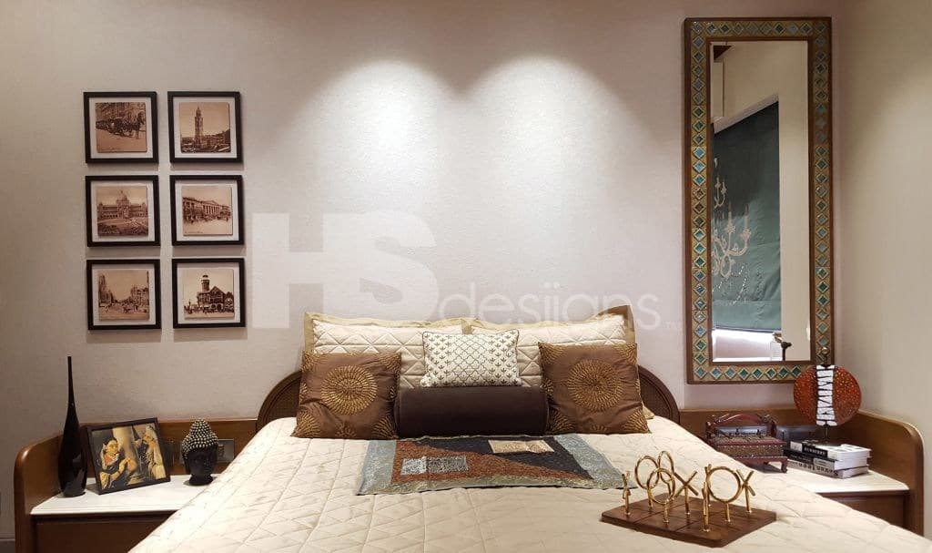 Traditional-Bedroom-accommodating-Wooden-Bed-with-Wooden-Side-Tables-Wooden-Headboard-Rectangular-Mirror-with-Traditional-Wooden-Frame-Collage-of-6-Wall-Paintings-Wooden-Wardrobe Design Detail Banner 1