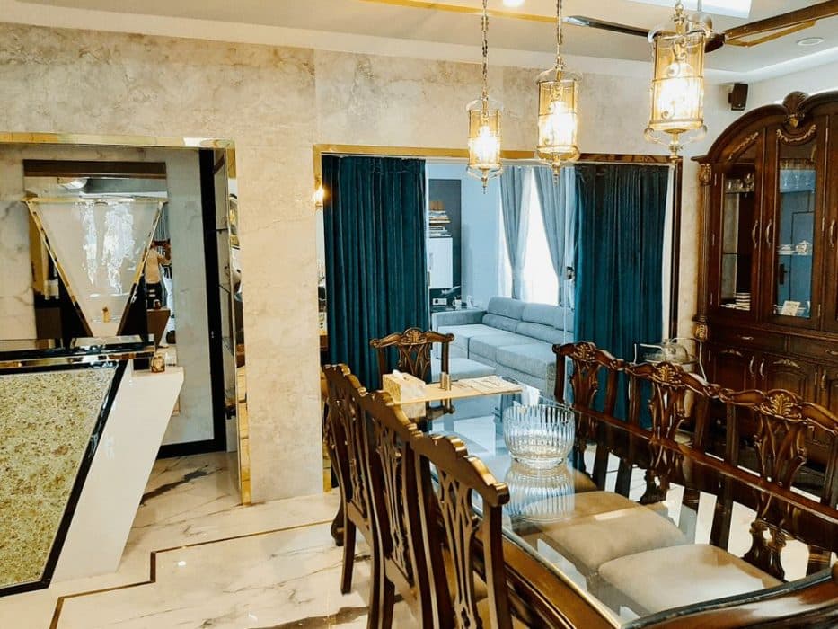 Traditional-Dining-Room-with-Marble-Flooring-highlighted-with-Metal-Strip-Inlay-8-Seater-Wooden-Dining-Table-with-Glass-Top. Design Detail Banner 1